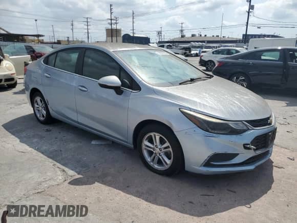 ✅ 2018 Chevrolet Cruze LT • VIN: 1G1BE5SM2J7114834 • Lot: 80557205. Listed on Copart with 131,256 mi. Free auction sales archive from the USA and detailed vehicle history report at DreamBid. Image 4.