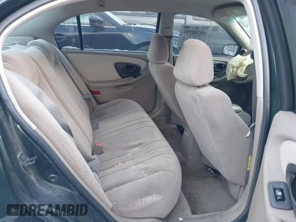 2003 Chevrolet Malibu z VIN 1G1ND52JX3M566217, wystawiony jako IAAI lot #41251951 z przebiegiem 94 727 mil mil oraz . Historia ofert i sprzedaży dostępna na DreamBid. Obrazek 8.