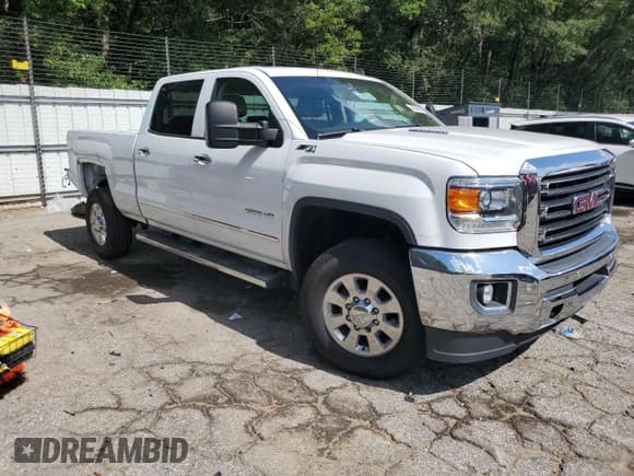 ✅ 2015 GMC Sierra 2500HD SLT • VIN: 1GT12ZE82FF129946 • Лот: 64542665. Опубликован ранее на Copart с пробегом 154 126 миль. Бесплатный доступ к архиву аукционных продаж из США и подробный отчёт об истории автомобиля на DreamBid. Изображение 4.