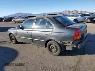 2005 Hyundai Accent GLS with VIN KMHCG45C95U665574, listed as a Copart auction lot 82603804 with 154,187 mi miles and Salvage title. Bid and sale history available at DreamBid. Image 2.