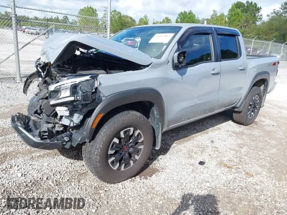 2022 Nissan Frontier Pro-4X z VIN 1N6ED1EK0NN620249, wystawiony jako IAAI lot #43387462 z przebiegiem 92 659 mil mil oraz . Historia ofert i sprzedaży dostępna na DreamBid. Obrazek 2.