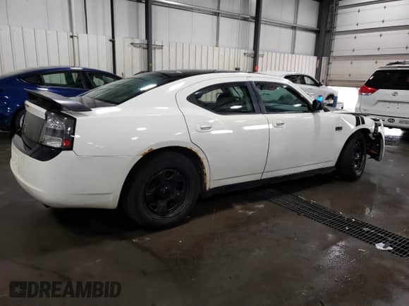 2009 Dodge Charger Police с VIN 2B3KA43T99H597615, выставлен на аукционе Copart как лот 75671074 с пробегом 199 004 миль миль и Списание • Salvage title. История ставок и продаж доступна на DreamBid. Изображение 3.