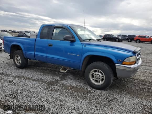 1999 Dodge Dakota SLT z VIN 1B7GG22X0XS285930, wystawiony jako Copart lot #79294374 z przebiegiem 189 988 mil mil oraz Nie do naprawy • Non repairable. Historia ofert i sprzedaży dostępna na DreamBid. Obrazek 4.