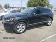 ✅ 2013 Volkswagen Touareg Lux • VIN: WVGEF9BP8DD005928 • Lot: 65650085. Listed on Copart with 111,843 mi. Free auction sales archive from the USA and detailed vehicle history report at DreamBid. Image 1.