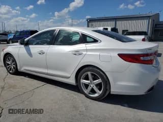 ✅ 2013 Hyundai Azera • VIN: KMHFG4JGXDA325761 • Лот: 70225975. Опубликован ранее на Copart с пробегом 126 944 миль. Бесплатный доступ к архиву аукционных продаж из США и подробный отчёт об истории автомобиля на DreamBid. Изображение 2.