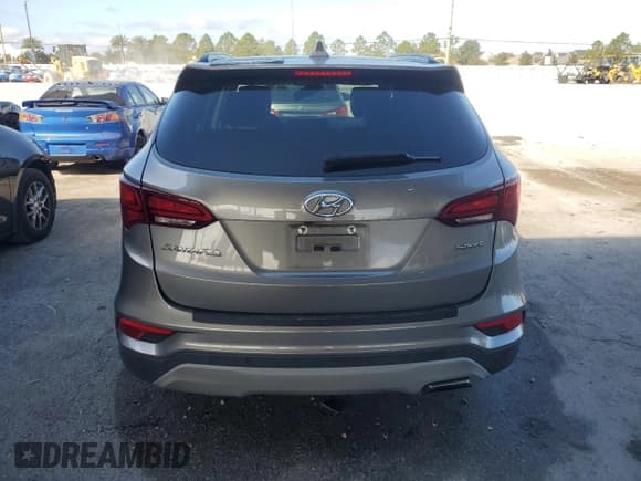 ✅ 2018 Hyundai Santa Fe 2.4L • VIN: 5XYZU3LB3JG556034 • Lot: 90231035. Listed on Copart with 26,542 mi. Free auction sales archive from the USA and detailed vehicle history report at DreamBid. Image 6.