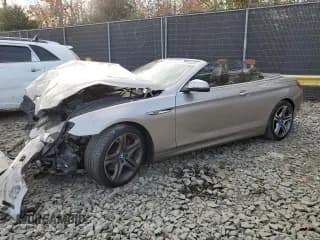 ✅ 2016 BMW 6 Series 650i xDrive • VIN: WBA6F7C50GD930473 • Лот: 79723834. Опубликован ранее на Copart с пробегом 100 131 миль. Бесплатный доступ к архиву аукционных продаж из США и подробный отчёт об истории автомобиля на DreamBid. Изображение 1.