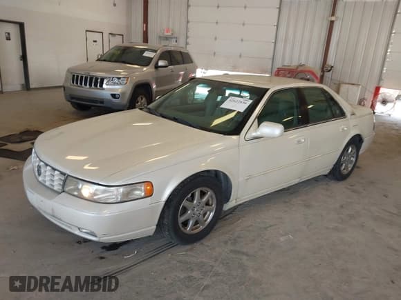 ✅ 2001 Cadillac Seville Touring STS • VIN: 1G6KY54911U168525 • Lot: 42622836. Listed on IAAI with 83,154 mi. Free auction sales archive from the USA and detailed vehicle history report at DreamBid. Image 2.
