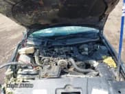 ✅ 1999 Lincoln Town Car Cartier • VIN: 1LNHM83W0XY673738 • Lot: 42437877. Listed on IAAI with 143,018 mi. Free auction sales archive from the USA and detailed vehicle history report at DreamBid. Image 10.