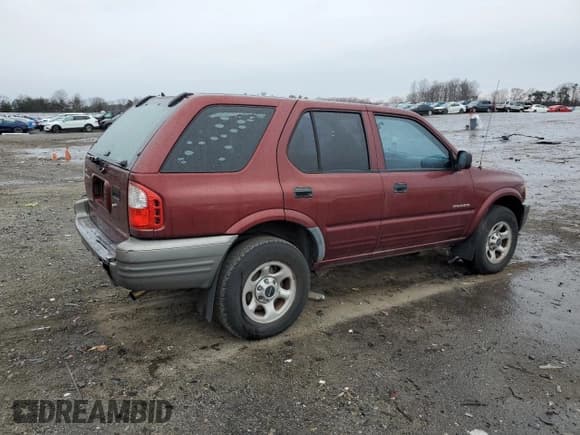 ✅ 2002 Isuzu Rodeo • VIN: 4S2CK58D124323937 • Lot: 86155194. Listed on Copart with 184,491 mi. Free auction sales archive from the USA and detailed vehicle history report at DreamBid. Image 3.