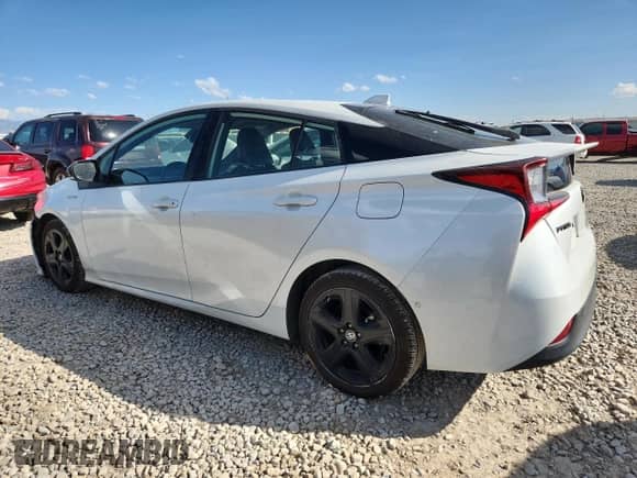 2021 Toyota Prius L Eco с VIN JTDKAMFU5M3127192, выставлен на аукционе Copart как лот 80371565 с пробегом 77 510 миль миль и Списание • Salvage title. История ставок и продаж доступна на DreamBid. Изображение 2.