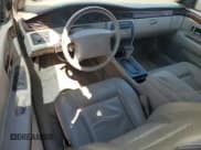 ✅ 1999 Cadillac Eldorado • VIN: 1G6EL12Y1XU610808 • Lot: 87164615. Wystawiony na Copart z przebiegiem 133 766 mil. Bezpłatny archiwum sprzedaży aukcyjnych z USA i szczegółowy raport historii pojazdu na DreamBid. Zdjęcie 8.