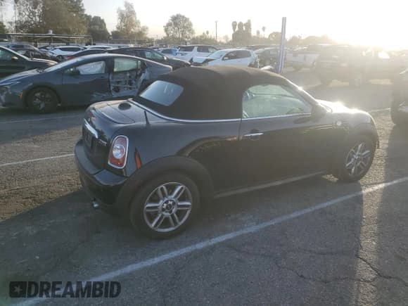✅ 2012 MINI Roadster • VIN: WMWSY1C58CT311609 • Lot: 87642395. Listed on Copart with 56,169 mi. Free auction sales archive from the USA and detailed vehicle history report at DreamBid. Image 3.