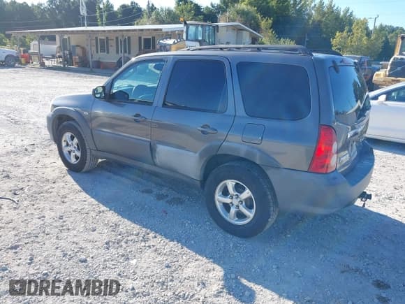 ✅ 2005 Mazda Tribute i • VIN: 4F2YZ02Z65KM48274 • Lot: 43129870. Listed on IAAI with 144,826 mi. Free auction sales archive from the USA and detailed vehicle history report at DreamBid. Image 3.