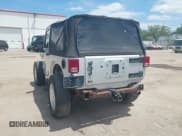 ✅ 2009 Jeep Wrangler X • VIN: 1J4FA24189L755392 • Lot: 42811063. Listed on IAAI with 97,644 mi. Free auction sales archive from the USA and detailed vehicle history report at DreamBid. Image 3.