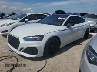 ✅ 2023 Audi RS 5 Sportback • VIN: WUAAWCF55PA900469 • Лот: 77256674. Опубликован ранее на Copart с пробегом 20 575 миль. Бесплатный доступ к архиву аукционных продаж из США и подробный отчёт об истории автомобиля на DreamBid. Изображение 1.