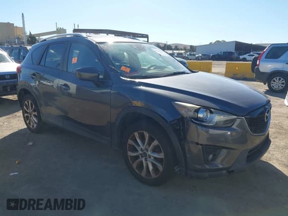 ✅ 2014 Mazda CX-5 Grand Touring • VIN: JM3KE4DY0E0355217 • Lot: 43433154. Listed on IAAI with 166,232 mi. Free auction sales archive from the USA and detailed vehicle history report at DreamBid. Image 1.
