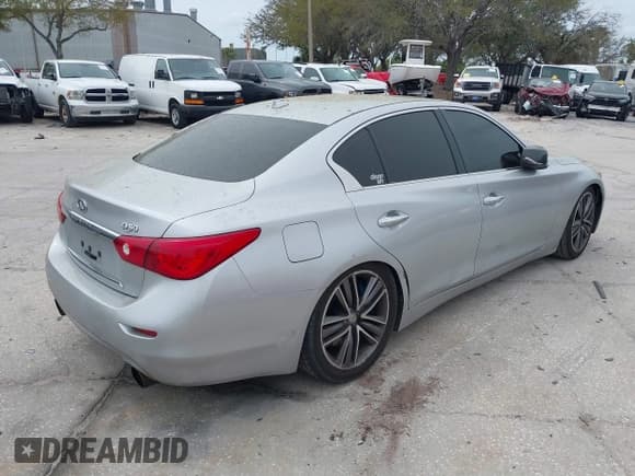 ✅ 2014 Infiniti Q50 Premium • VIN: JN1BV7AP4EM692135 • Lot: 38874654. Listed on IAAI with 104,348 mi. Free auction sales archive from the USA and detailed vehicle history report at DreamBid. Image 4.