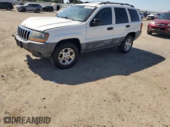✅ 1999 Jeep Grand Cherokee Laredo • VIN: 1J4G258S8XC735159 • Lot: 56247505. Wystawiony na Copart z przebiegiem 241 636 mil. Bezpłatny archiwum sprzedaży aukcyjnych z USA i szczegółowy raport historii pojazdu na DreamBid. Zdjęcie 1.