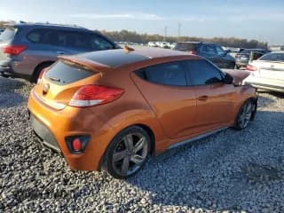 ✅ 2015 Hyundai Veloster Turbo • VIN: KMHTC6AE2FU244411 • Lot: 82022114. Wystawiony na Copart z przebiegiem 132 639 mil. Bezpłatny archiwum sprzedaży aukcyjnych z USA i szczegółowy raport historii pojazdu na DreamBid. Zdjęcie 3.