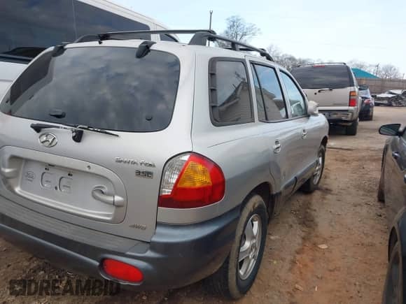 2004 Hyundai Santa Fe GLS with VIN KM8SC73E84U604051, listed as a IAAI auction lot 41441265 with Not provided miles and . Bid and sale history available at DreamBid. Image 4.