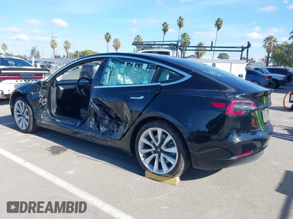 ✅ 2018 Tesla Model 3 Long Range Battery • VIN: 5YJ3E1EA8JF169904 • Lot: 43629032. Listed on IAAI with 90,632 mi. Free auction sales archive from the USA and detailed vehicle history report at DreamBid. Image 3.
