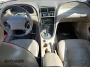 ✅ 2003 Ford Mustang Deluxe • VIN: 1FAFP44413F386140 • Lot: 85580595. Listed on Copart with 96,580 mi. Free auction sales archive from the USA and detailed vehicle history report at DreamBid. Image 8.