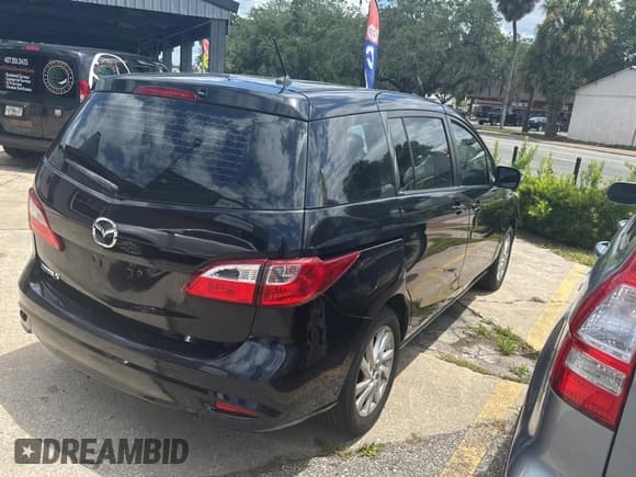 ✅ 2015 Mazda 5 Sport • VIN: JM1CW2BLXF0182880 • Лот: 59904084. Опубликован ранее на Copart с пробегом 100 383 миль. Бесплатный доступ к архиву аукционных продаж из США и подробный отчёт об истории автомобиля на DreamBid. Изображение 4.