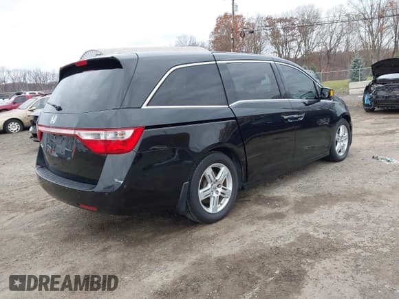 ✅ 2011 Honda Odyssey Touring • VIN: 5FNRL5H90BB014208 • Lot: 43682256. Listed on IAAI with 169,536 mi. Free auction sales archive from the USA and detailed vehicle history report at DreamBid. Image 4.