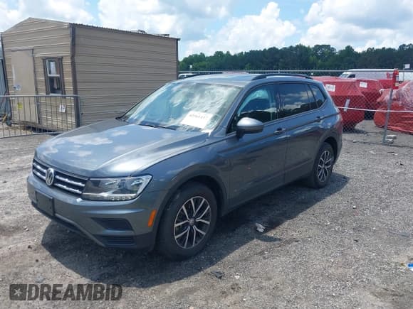 ✅ 2021 Volkswagen Tiguan S • VIN: 3VV1B7AX5MM148491 • Lot: 42561437. Listed on IAAI with 54,084 mi. Free auction sales archive from the USA and detailed vehicle history report at DreamBid. Image 2.