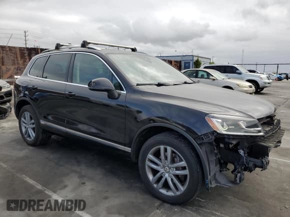 ✅ 2016 Volkswagen Touareg Sport • VIN: WVGEF9BP3GD011138 • Lot: 53557195. Listed on Copart with 75,825 mi. Free auction sales archive from the USA and detailed vehicle history report at DreamBid. Image 4.