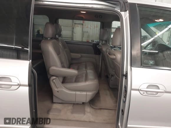 ✅ 2004 Honda Odyssey EX-L • VIN: 5FNRL18924B038571 • Lot: 43251200. Wystawiony na IAAI z przebiegiem 231 427 mil. Bezpłatny archiwum sprzedaży aukcyjnych z USA i szczegółowy raport historii pojazdu na DreamBid. Zdjęcie 8.