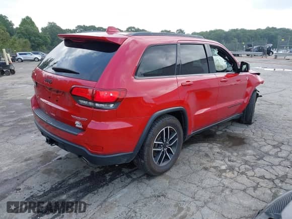 2021 Jeep Grand Cherokee Trailhawk with VIN 1C4RJFLGXMC579888, listed as a IAAI auction lot 42951354 with 76,948 mi miles and . Bid and sale history available at DreamBid. Image 4.