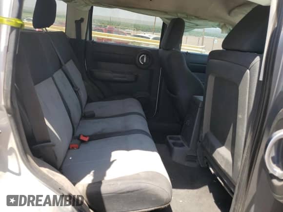 2007 Dodge Nitro SXT z VIN 1D8GU28K97W636431, wystawiony jako Copart lot #66031104 z przebiegiem 184 002 mil mil oraz Szkoda całkowita • Salvage title. Historia ofert i sprzedaży dostępna na DreamBid. Obrazek 10.