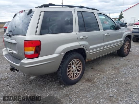 ✅ 2003 Jeep Grand Cherokee Limited • VIN: 1J4GW58N43C585592 • Lot: 43464160. Listed on IAAI with 115,373 mi. Free auction sales archive from the USA and detailed vehicle history report at DreamBid. Image 4.