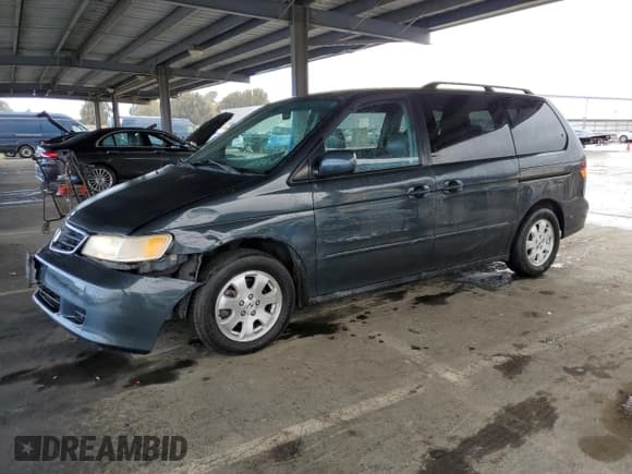 ✅ 2004 Honda Odyssey EX-L • VIN: 5FNRL18784B103373 • Lot: 50798945. Listed on Copart with 150,318 mi. Free auction sales archive from the USA and detailed vehicle history report at DreamBid. Image 1.