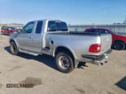 ✅ 1998 Ford F-150 XL • VIN: 2FTZX08W2WCA36561 • Lot: 94142665. Listed on Copart with 206,661 mi. Free auction sales archive from the USA and detailed vehicle history report at DreamBid. Image 2.