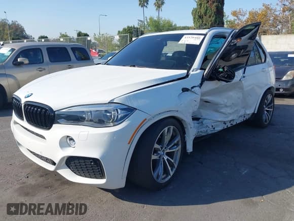✅ 2014 BMW X5 xDrive35i • VIN: 5UXKR0C53E0H21184 • Lot: 43520480. Listed on IAAI with 75,808 mi. Free auction sales archive from the USA and detailed vehicle history report at DreamBid. Image 2.