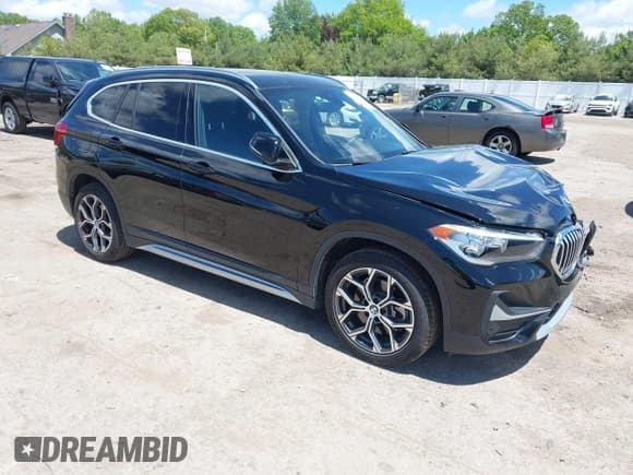✅ 2022 BMW X1 xDrive28i • VIN: WBXJG9C00N5U64709 • Lot: 42319210. Listed on IAAI with 37,062 mi. Free auction sales archive from the USA and detailed vehicle history report at DreamBid. Image 1.