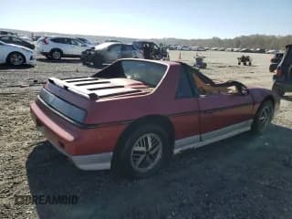 ✅ 1986 Pontiac Fiero • VIN: 1G2PF3794GP243268 • Lot: 77030964. Wystawiony na Copart z przebiegiem 229 244 mil. Bezpłatny archiwum sprzedaży aukcyjnych z USA i szczegółowy raport historii pojazdu na DreamBid. Zdjęcie 3.