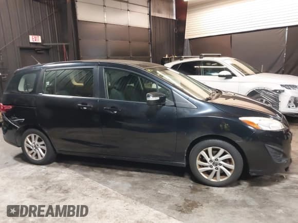 ✅ 2014 Mazda 5 Sport • VIN: JM1CW2BL5E0163023 • Lot: 42517864. Listed on IAAI with 129,483 mi. Free auction sales archive from the USA and detailed vehicle history report at DreamBid. Image 13.
