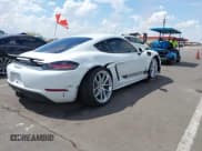 ✅ 2025 Porsche Cayman • VIN: WP0AA2A83SK255637 • Lot: 42218504. Listed on IAAI with 3,130 mi. Free auction sales archive from the USA and detailed vehicle history report at DreamBid. Image 4.