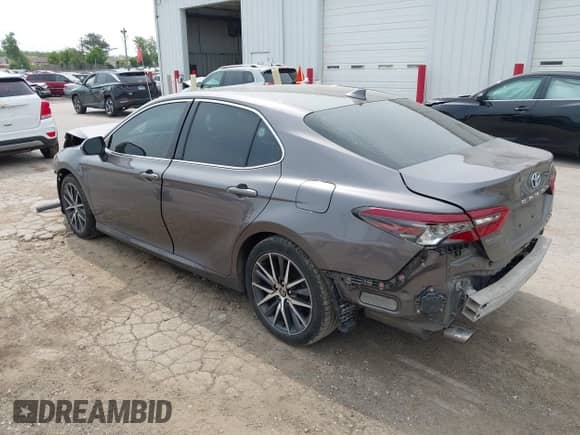 2022 Toyota Camry Hybrid XLE with VIN 4T1F31AK2NU573291, listed as a IAAI auction lot 42407207 with 65,222 mi miles and . Bid and sale history available at DreamBid. Image 3.