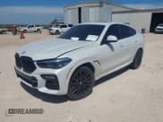 ✅ 2021 BMW X6 M50i • VIN: 5UXCY8C02M9H19933 • Лот: 42570118. Опубликован ранее на IAAI с пробегом 73 648 миль. Бесплатный доступ к архиву аукционных продаж из США и подробный отчёт об истории автомобиля на DreamBid. Изображение 2.