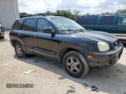 ✅ 2004 Hyundai Santa Fe GLS • VIN: KM8SC13E54U619183 • Lot: 81597735. Listed on Copart with 203,503 mi. Free auction sales archive from the USA and detailed vehicle history report at DreamBid. Image 4.