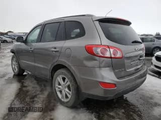 ✅ 2012 Hyundai Santa Fe SE • VIN: 5XYZHDAG8CG122087 • Lot: 87845555. Listed on Copart with Not provided. Free auction sales archive from the USA and detailed vehicle history report at DreamBid. Image 2.