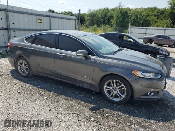 ✅ 2015 Ford Fusion Titanium Hybrid • VIN: 3FA6P0RU4FR220655 • Lot: 71635975. Wystawiony na Copart z przebiegiem 186 717 mil. Bezpłatny archiwum sprzedaży aukcyjnych z USA i szczegółowy raport historii pojazdu na DreamBid. Zdjęcie 4.