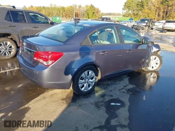 ✅ 2014 Chevrolet Cruze LS • VIN: 1G1PA5SHXE7464206 • Lot: 43599999. Listed on IAAI with 130,122 mi. Free auction sales archive from the USA and detailed vehicle history report at DreamBid. Image 4.