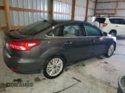 ✅ 2018 Ford Focus Titanium • VIN: 1FADP3J21JL316897 • Lot: 90242585. Wystawiony na Copart z przebiegiem 132 305 mil. Bezpłatny archiwum sprzedaży aukcyjnych z USA i szczegółowy raport historii pojazdu na DreamBid. Zdjęcie 3.