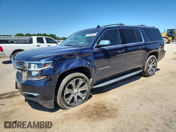 2019 Chevrolet Suburban Premier with VIN 1GNSCJKCXKR110511, listed as a Copart auction lot 71028945 with 87,669 mi miles and Salvage title. Bid and sale history available at DreamBid. Image 1.